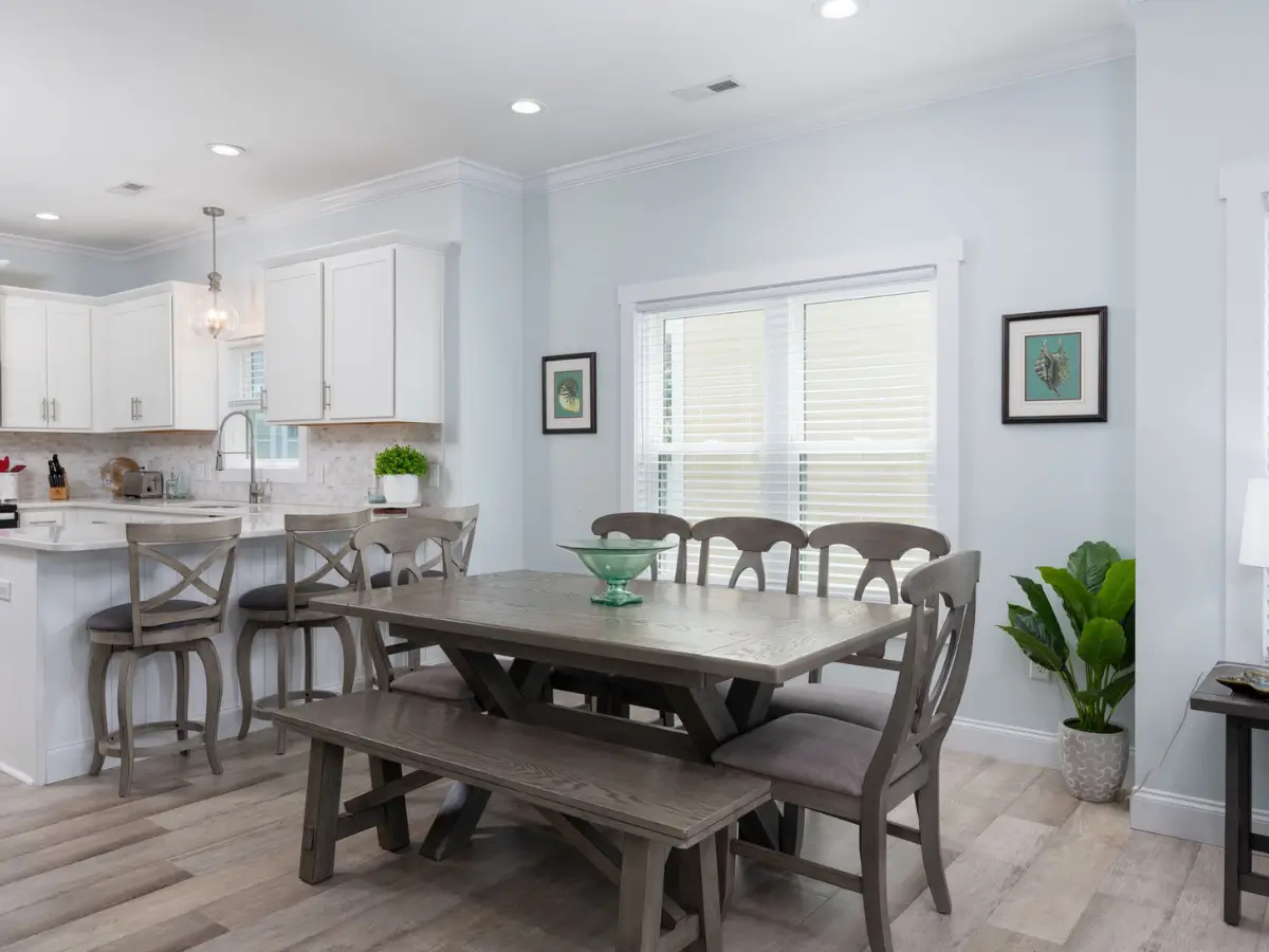 Coastal dining room with seating for family meals at A Sail Away in Carolina Beach.