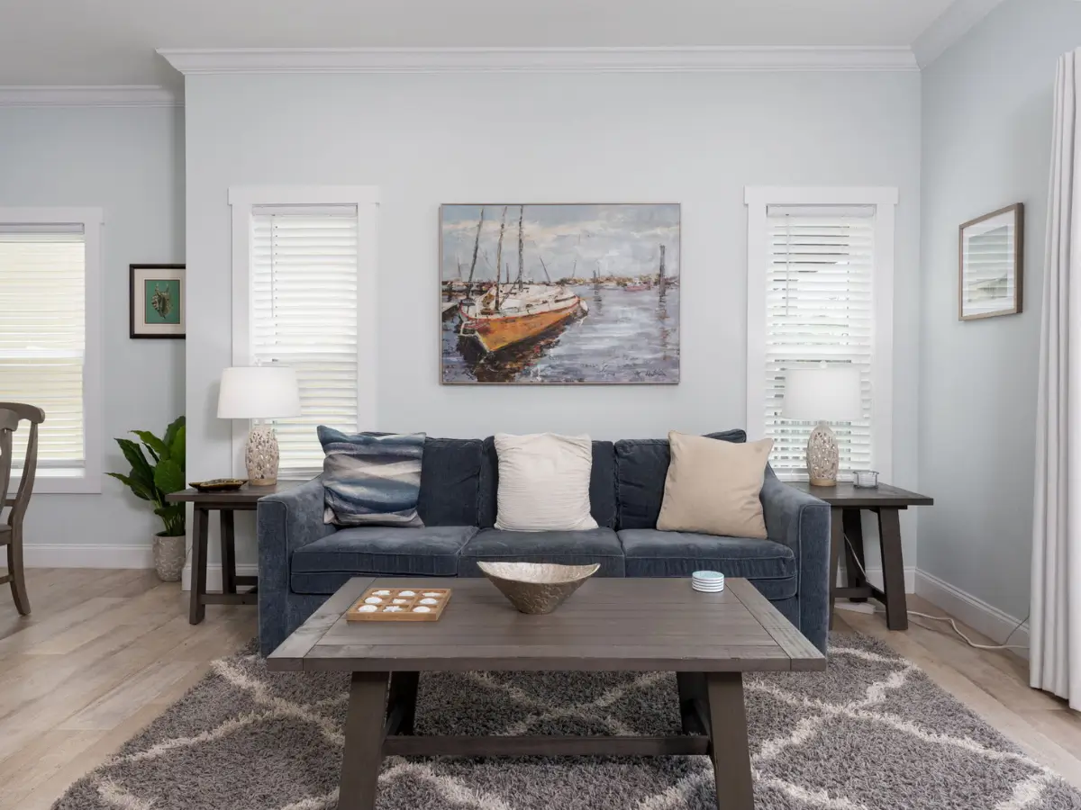 Bright coastal living room with comfortable seating and open layout at A Sail Away in Carolina Beach.