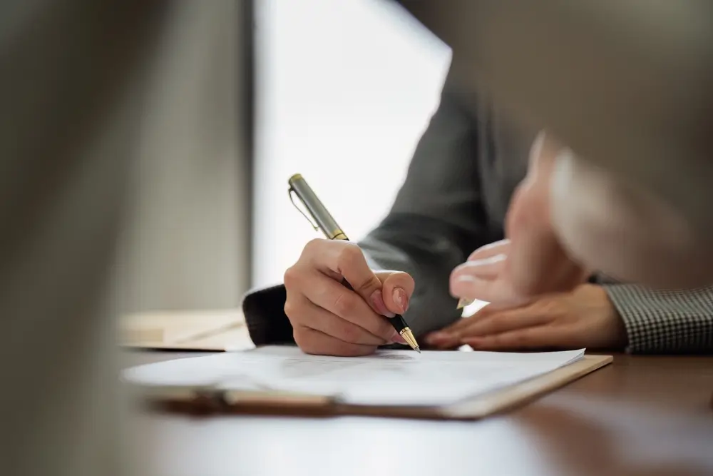 Property owner reviewing North Carolina landlord laws and rental management documents.
