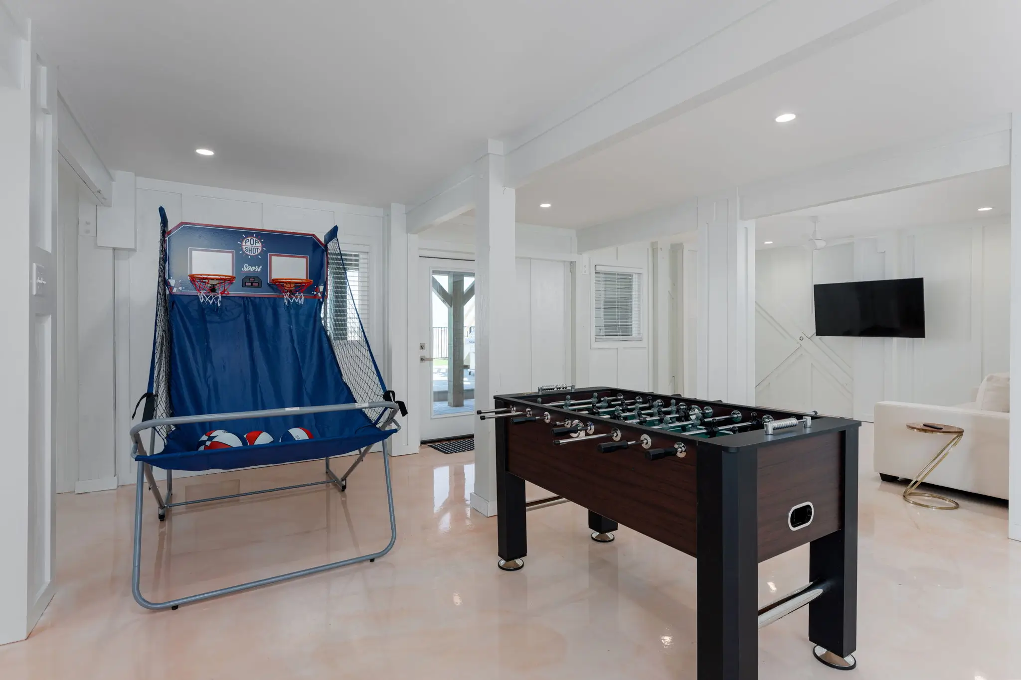 Game room with basketball arcade and foosball table at The Pearl
