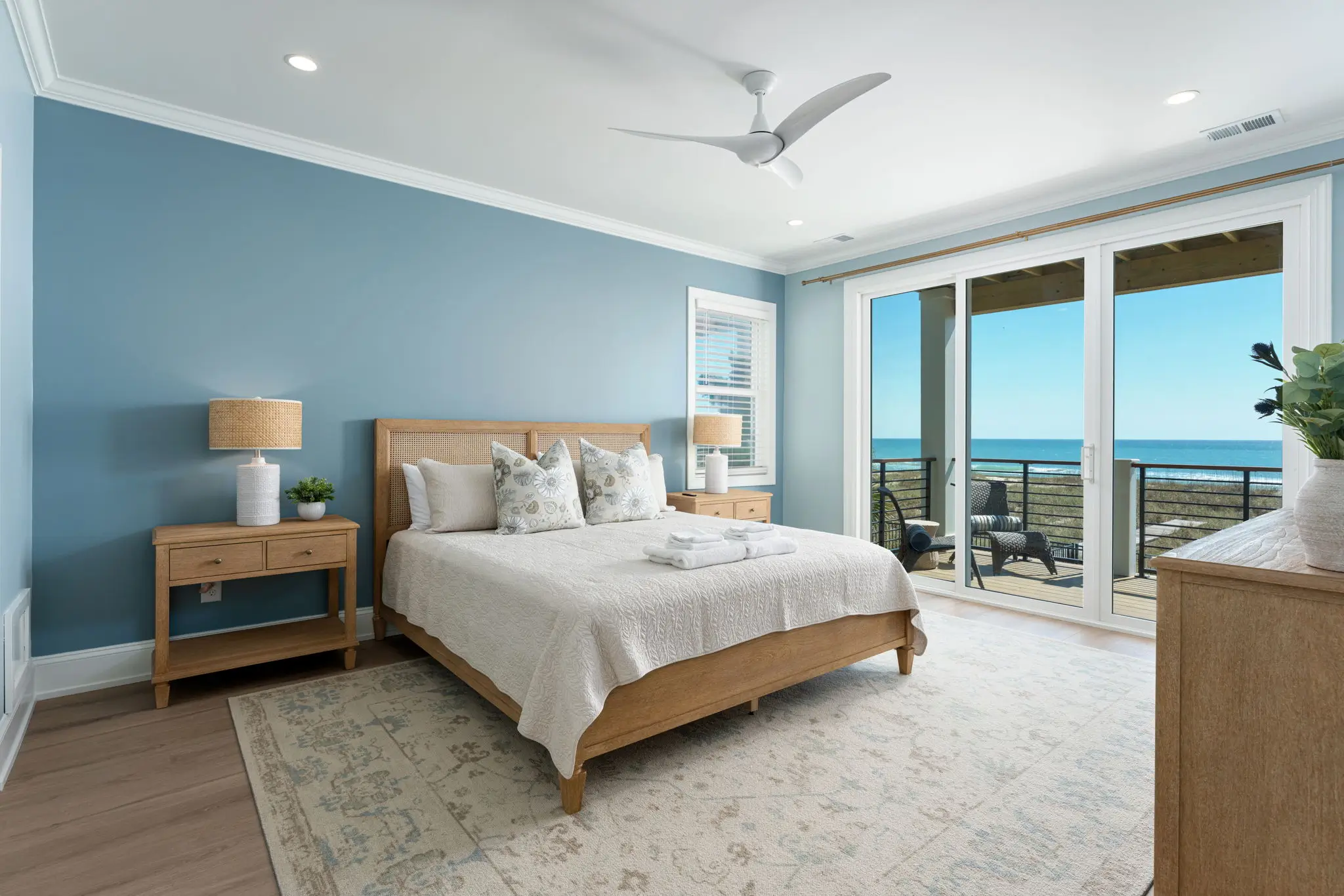 Oceanfront king bedroom with private deck access at The Pearl