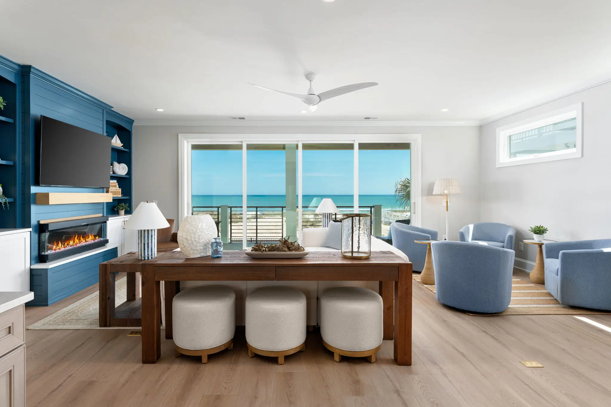 Open-concept living and dining area with panoramic Kure Beach ocean views