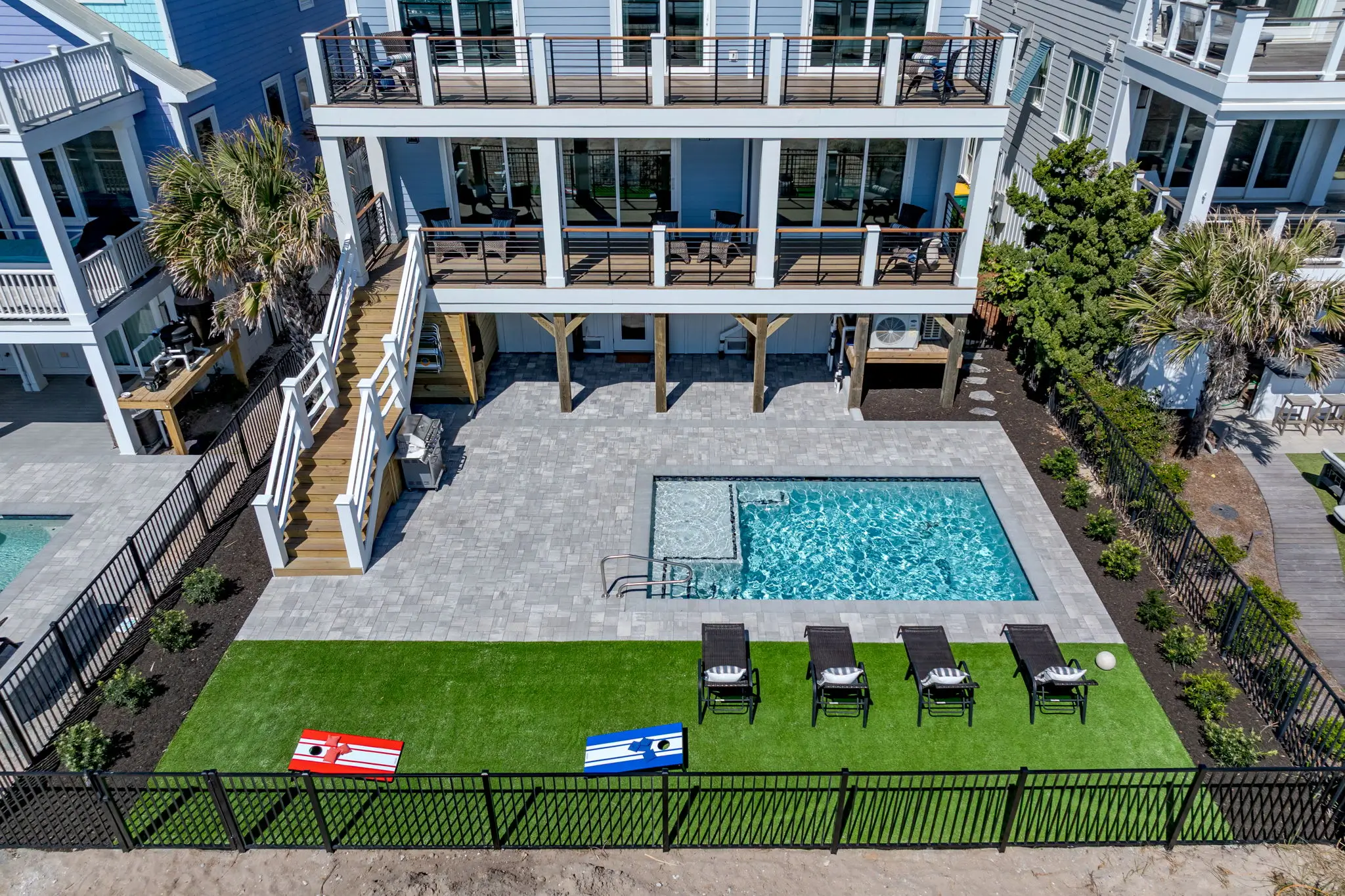 Aerial view of The Pearl’s private pool and direct beach access in Kure Beach