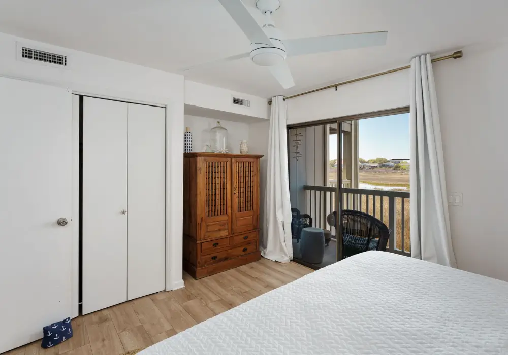 Coastal bedroom with king bed and marsh views at The Sunshine Shack
