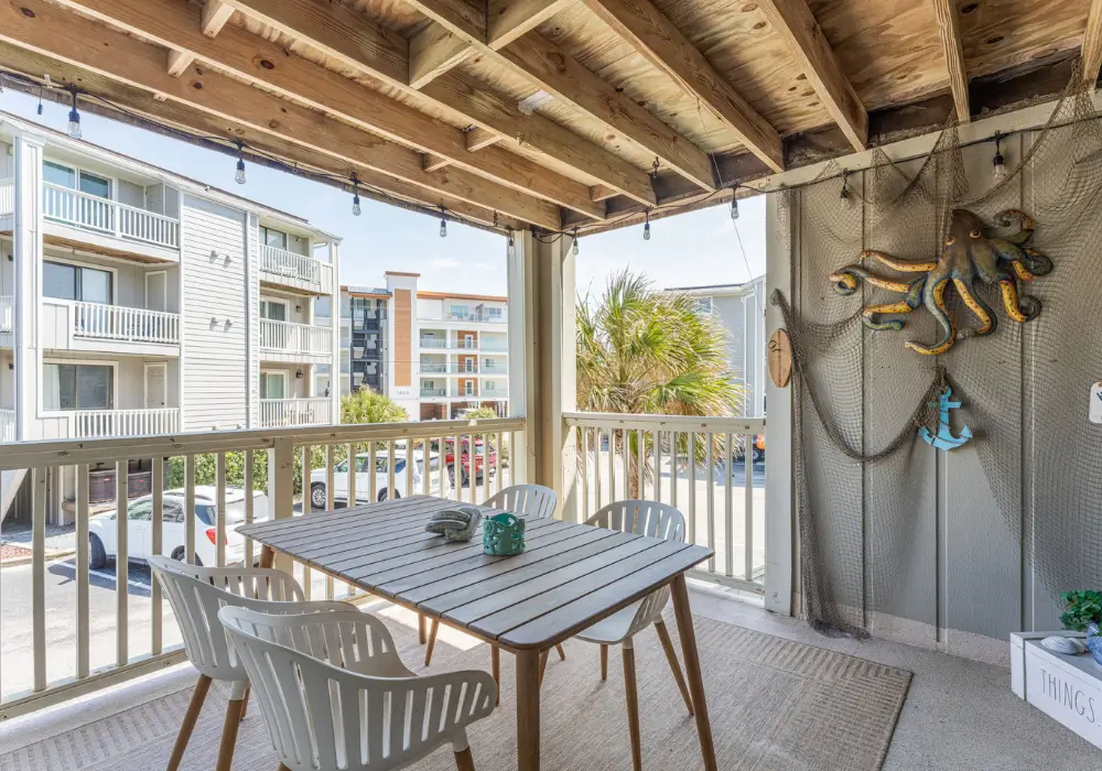 Covered front porch with outdoor dining at The Sunshine Shack