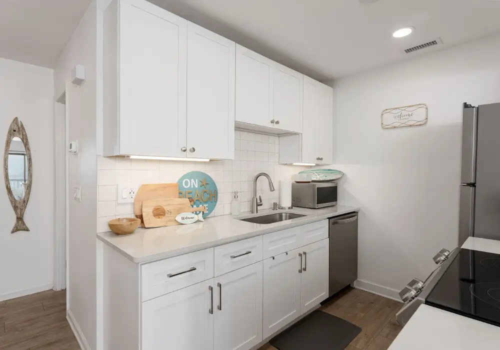 Updated white kitchen at The Sunshine Shack Carolina Beach condo