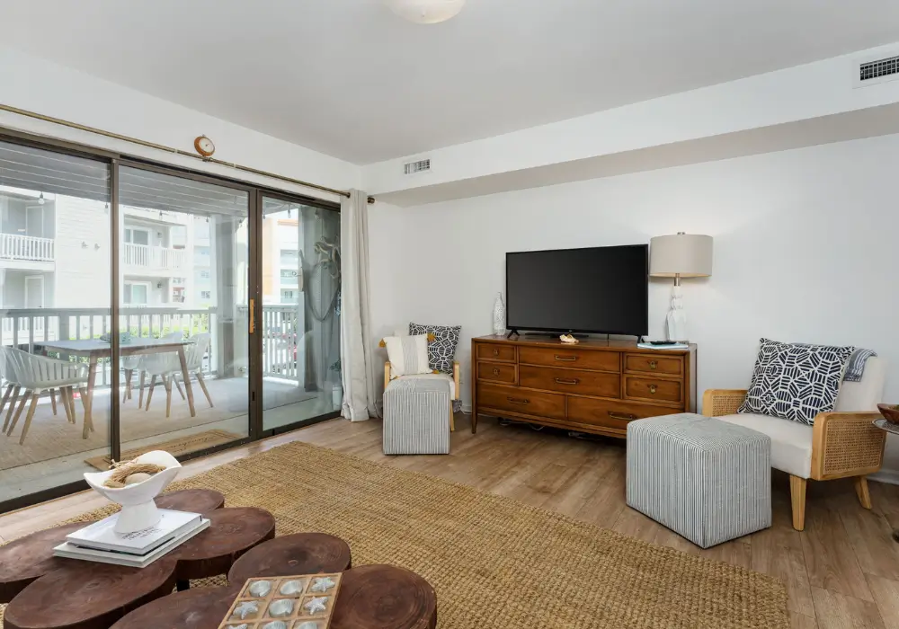 Living room with sliding doors leading to the covered porch