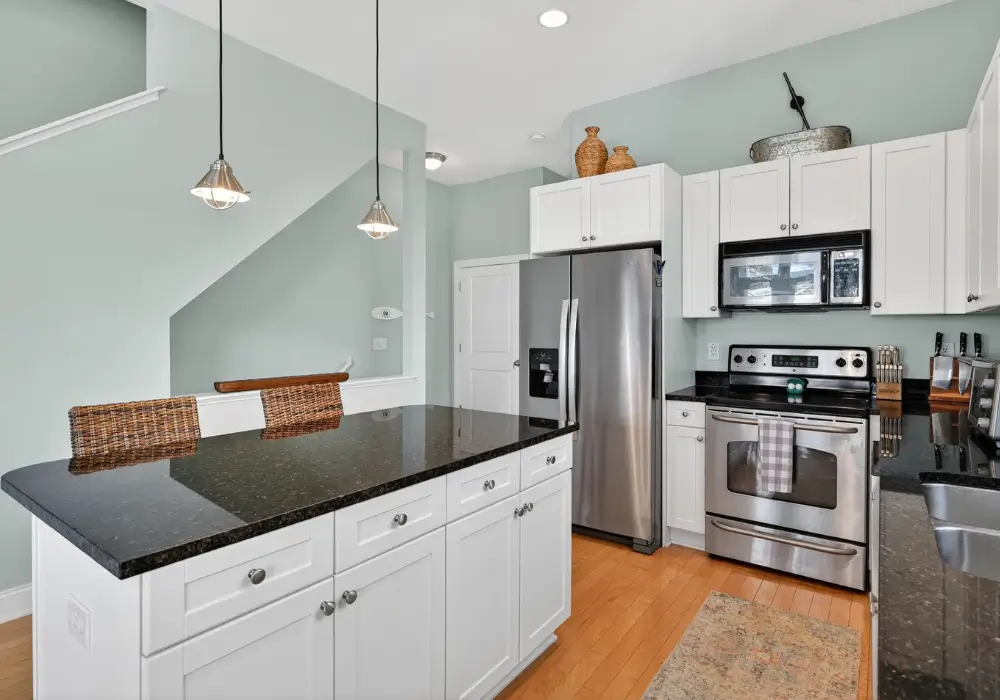 Fully equipped kitchen with island and stainless steel appliances at Tuna Luna