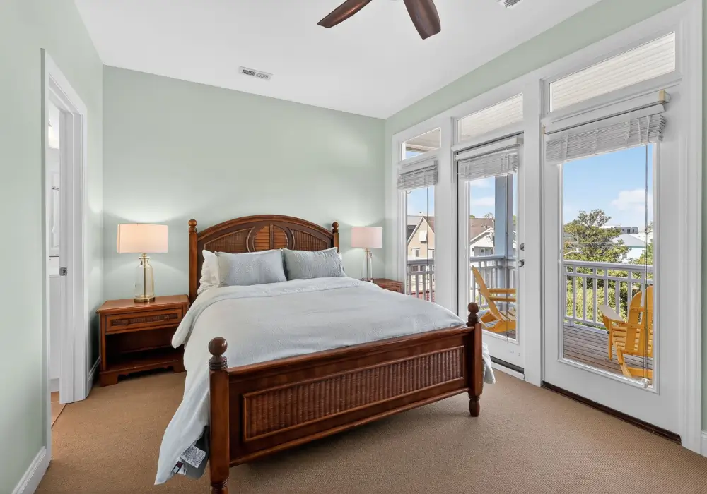 Primary bedroom with private balcony at Tuna Luna in Carolina Beach